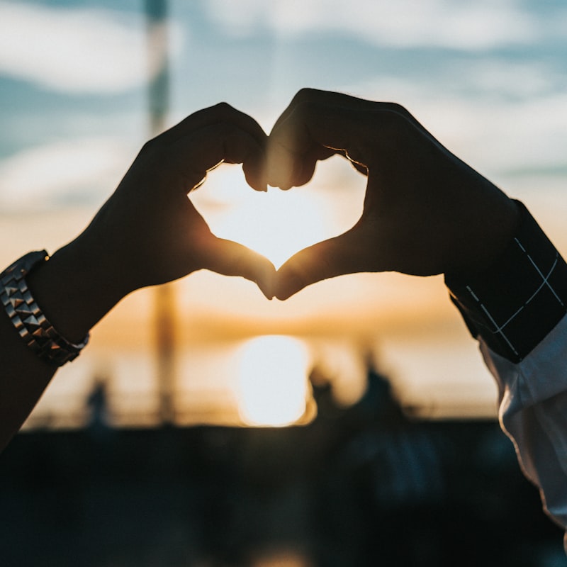 Two people making a heart — settle shared costs with ID Remit