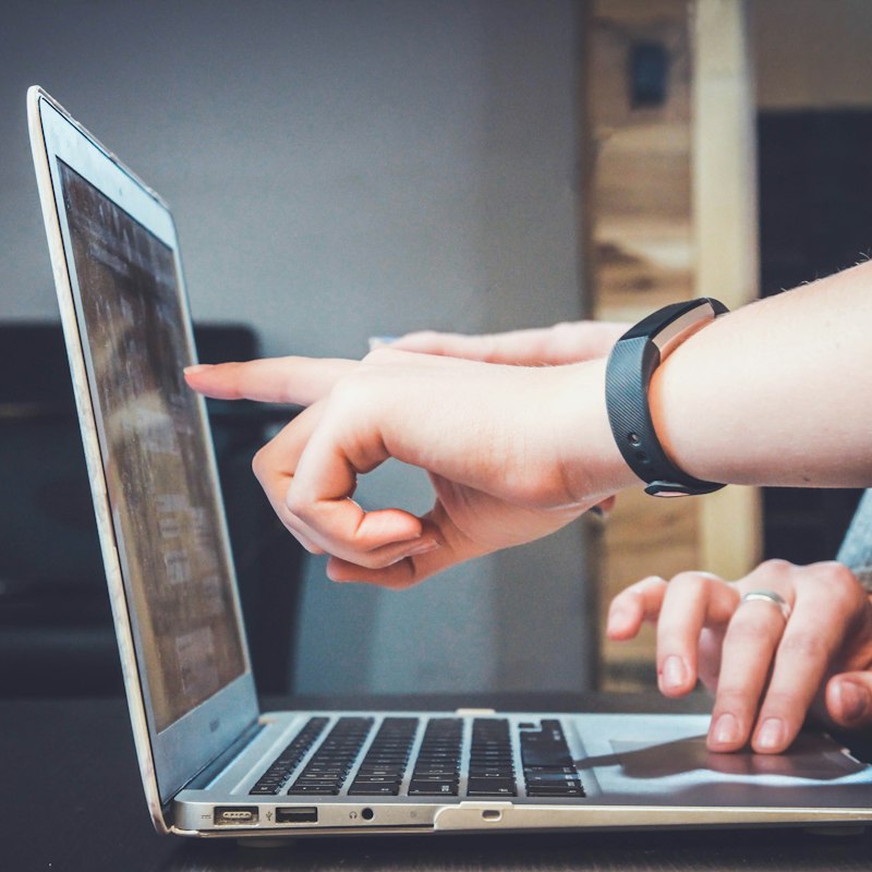 A student at a laptop — send campus support with ID Remit